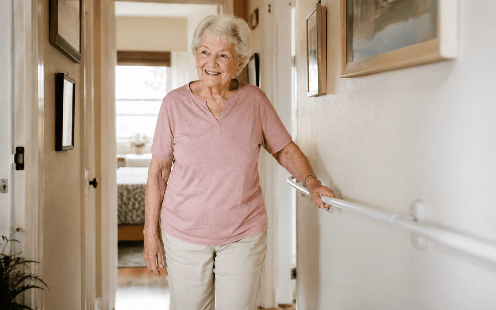 Well-lit hallway with a grab rail or clear walkway, or someone steady on their feet at home